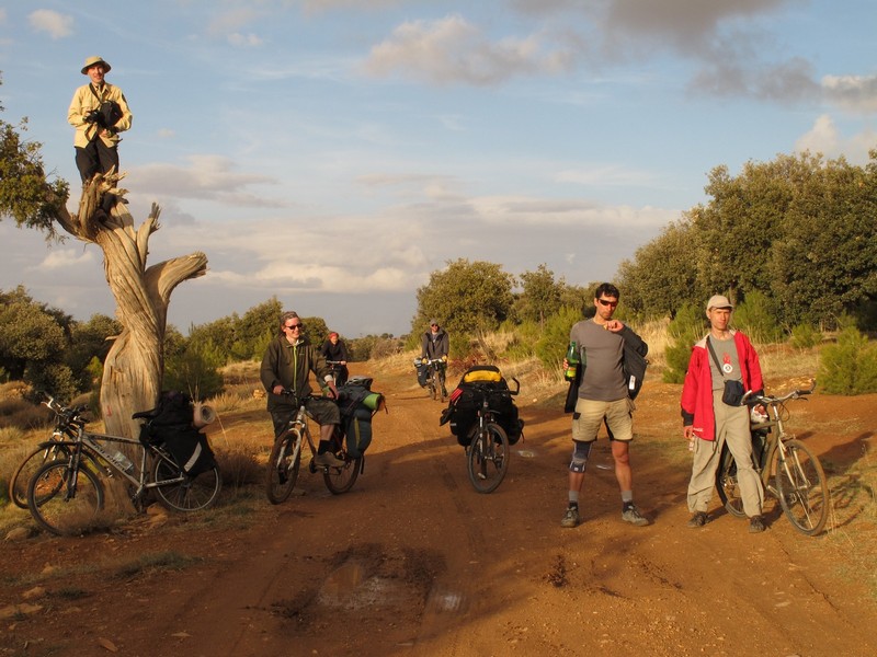 Morocco, Cirque du Jaffar. Bicycle group on the dirt road