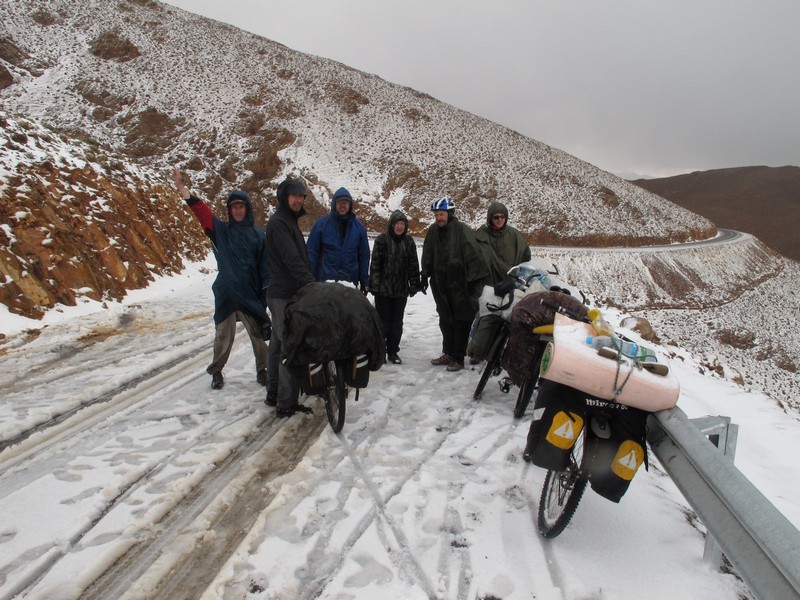 Morocco, High Atlas. Bicycle group after snow pass