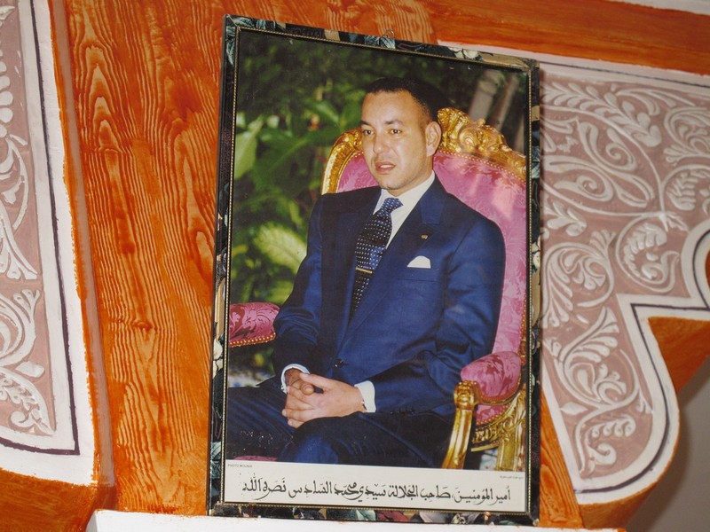 Morocco, Dades gorge. King Mohamed VI portrait in the cafe