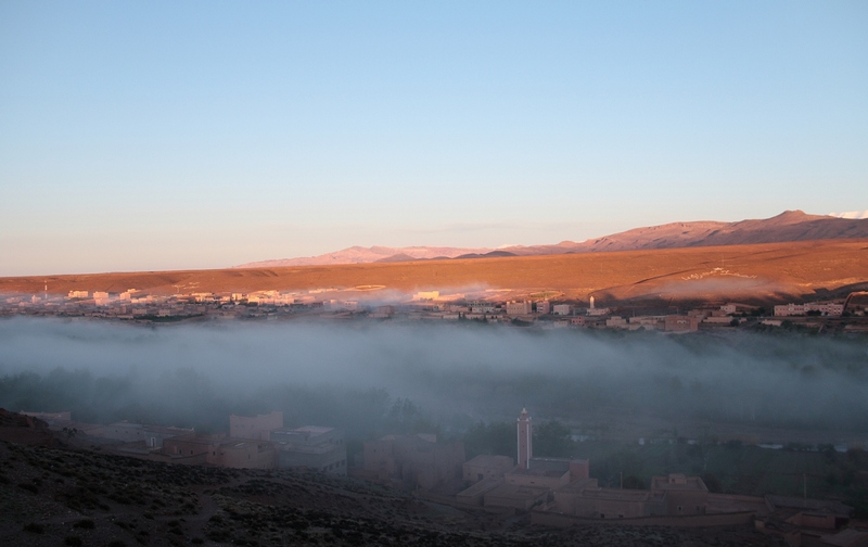 Morocco, Boumalne Dades. Morning mist on the town