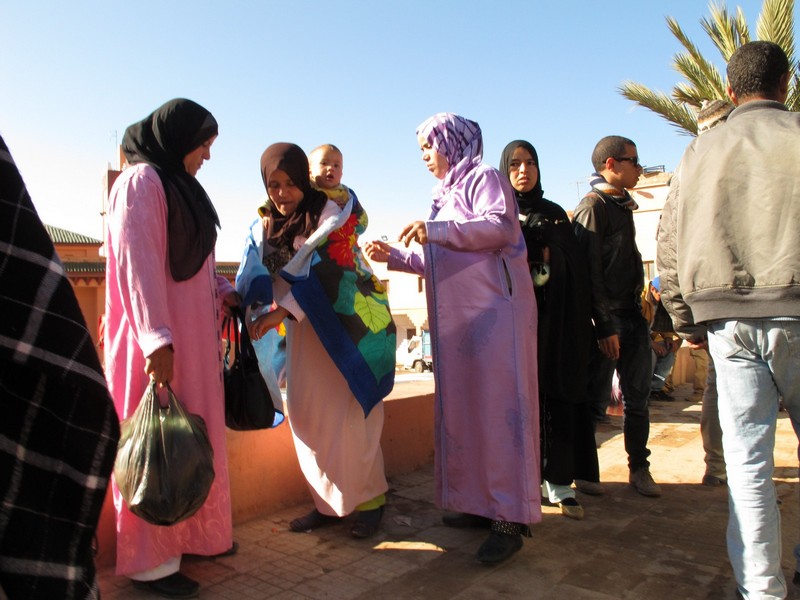 Morocco, Boumalne Dades. Womem on the bus stop