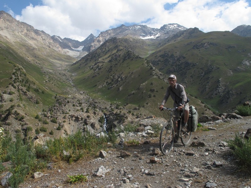 Tajikistan, Yagnob. Alone cyclist on the stone path