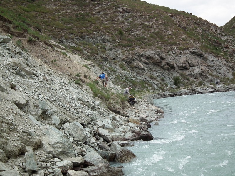 Tajikistan, Yagnob. River waters with stone bank