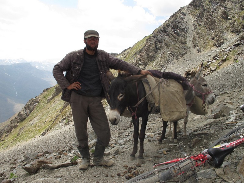 Tajikistan, Rost pass. Shepherd with donkey
