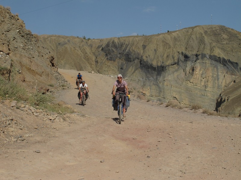 Tajikistan, Zeravshan river. Dusty road by bicycle