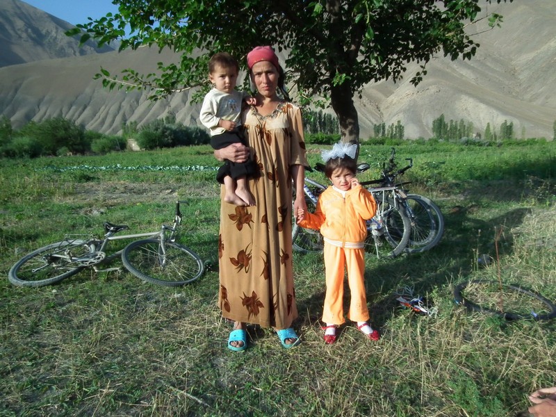 Tajikistan, Ayni. Tajik woman with 2 children