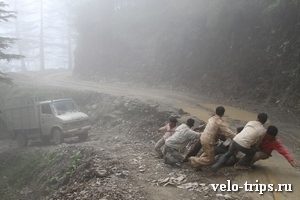 India. Road from Shimla to Rampur. Indians pulling truck.