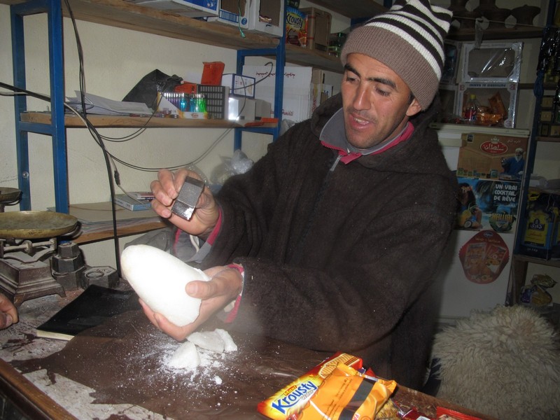 Morocco, Tagoudite. Breaking sugar from big lumps to small bits