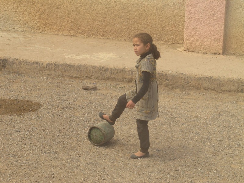 Morocco, girl playing with gas baloon