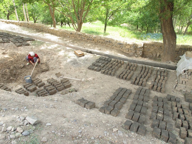 Tajikistan, Zeravshan river. Mud brick making