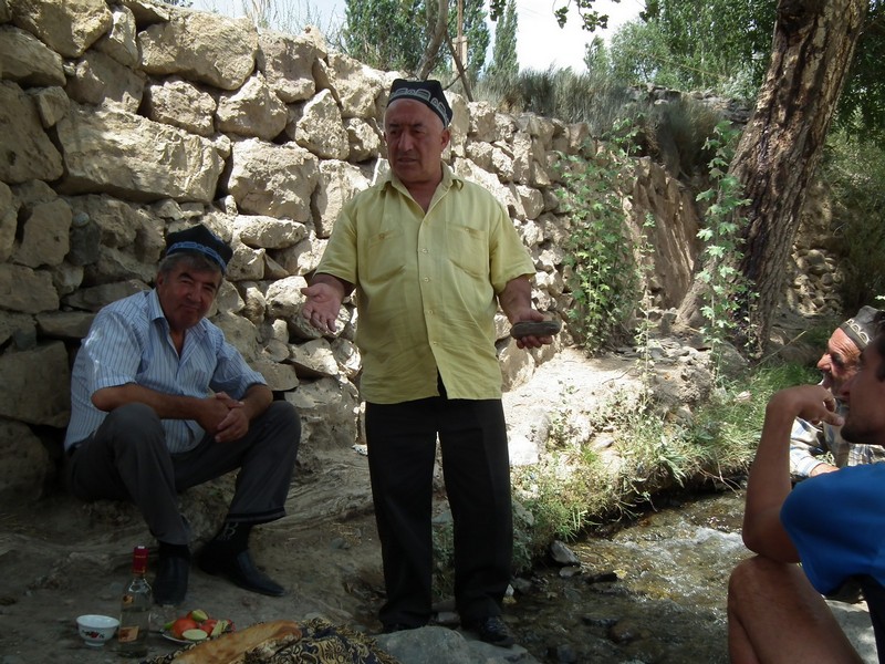 Tajikistan, Zeravshan river. Native people drinking vodka