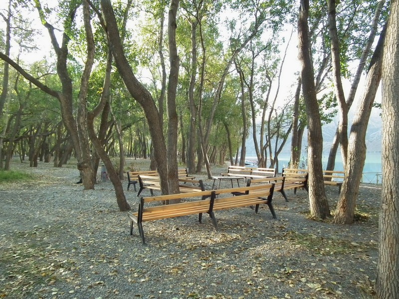 Iskanderkul lake. Camping bank and benchs