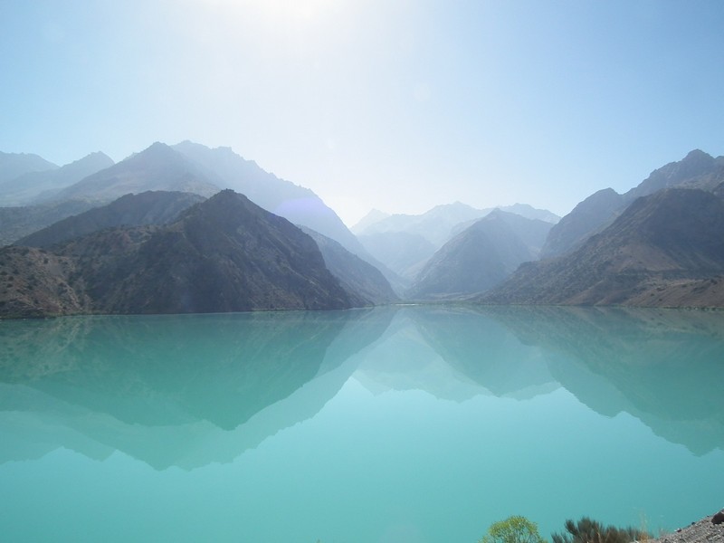 Iskanderkul lake. Multi reflection of the mountains